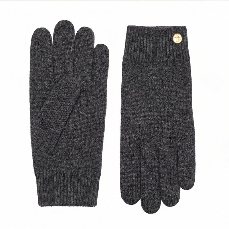 Pair of dark gray gloves with a gold button on a white background