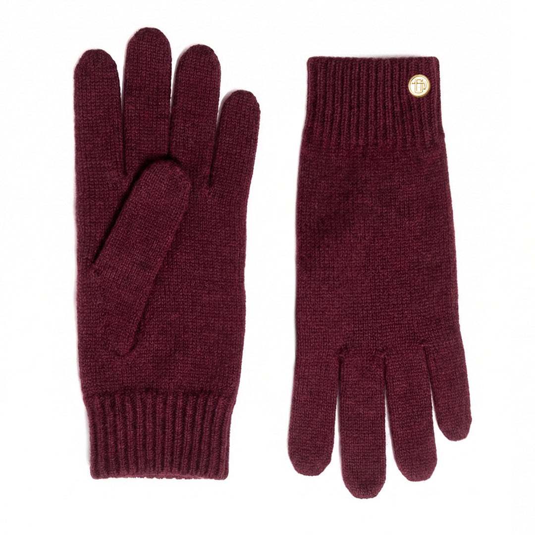 Pair of maroon gloves with a gold button on a white background