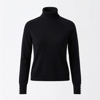 Black turtleneck sweater on a light gray background