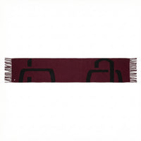 Maroon scarf with black geometric patterns on a white background