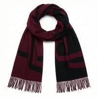 Maroon and black striped scarf with fringes on a white background
