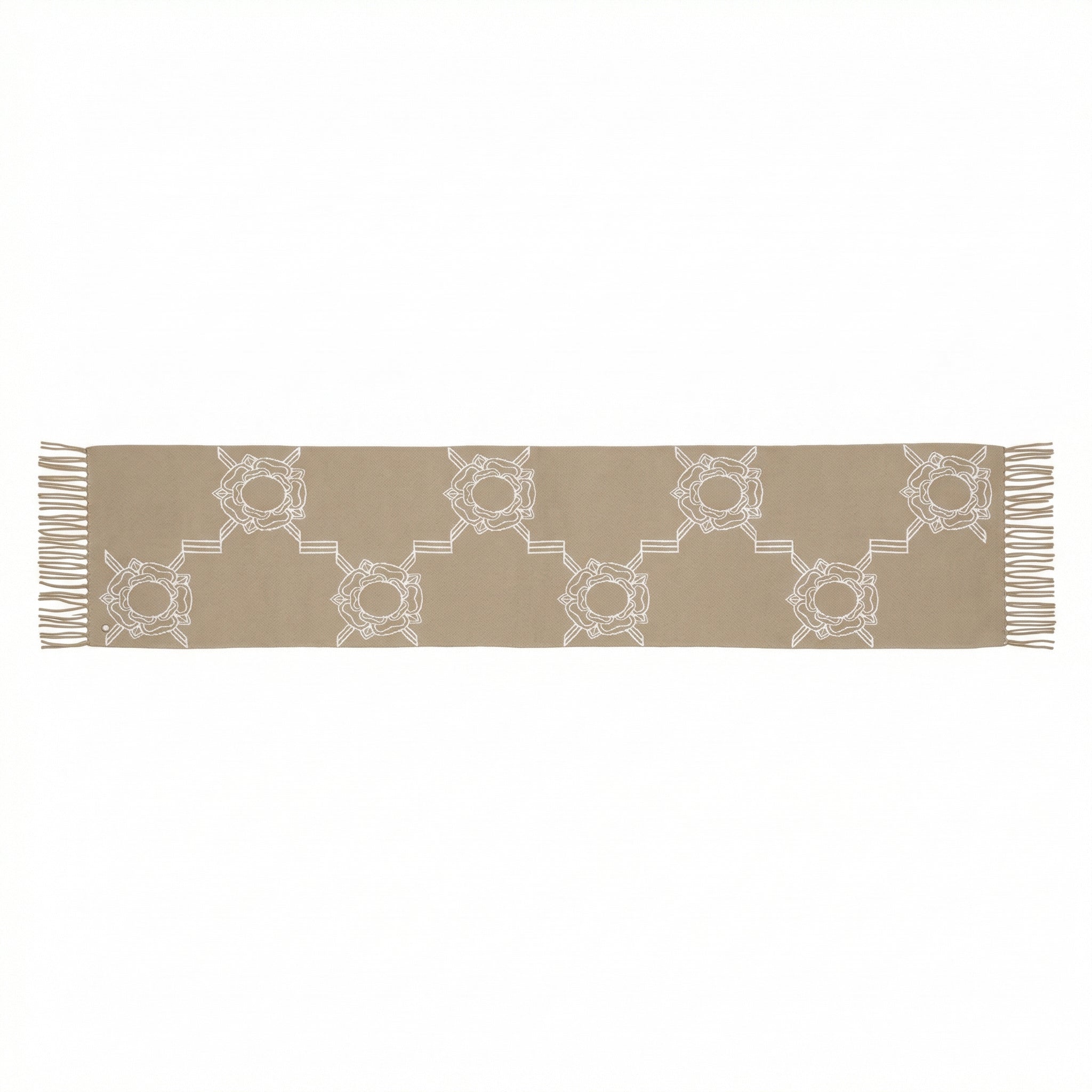 Beige table runner with white geometric pattern on a white background