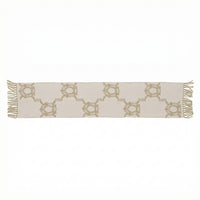 Beige table runner with gold geometric pattern on a white background